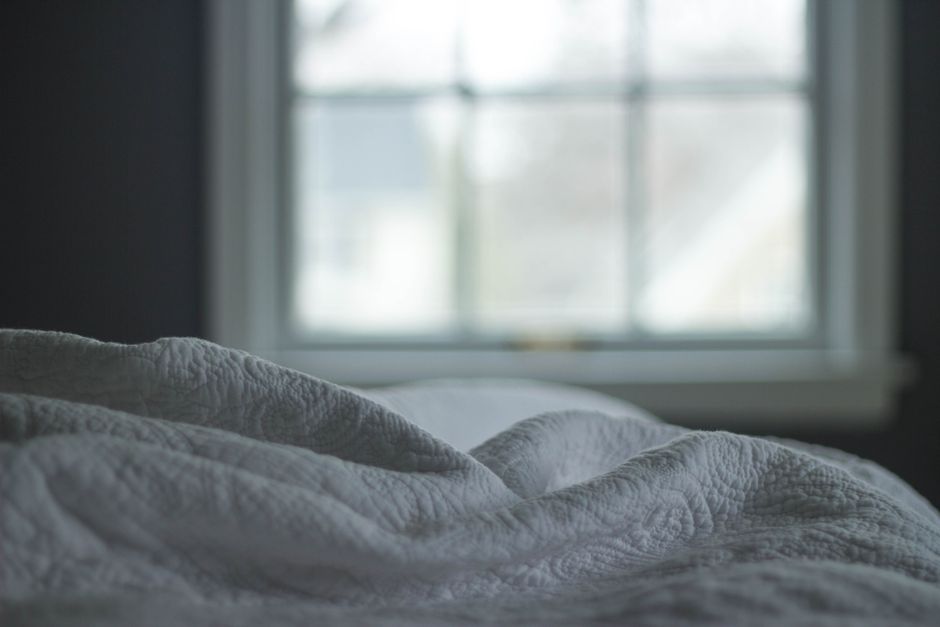 Soft morning light coming through a bedroom window